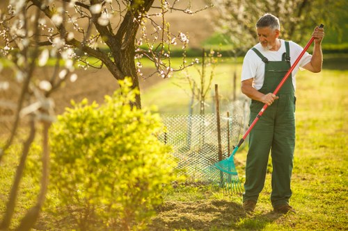 Workers managing green waste and rubbish removal safely